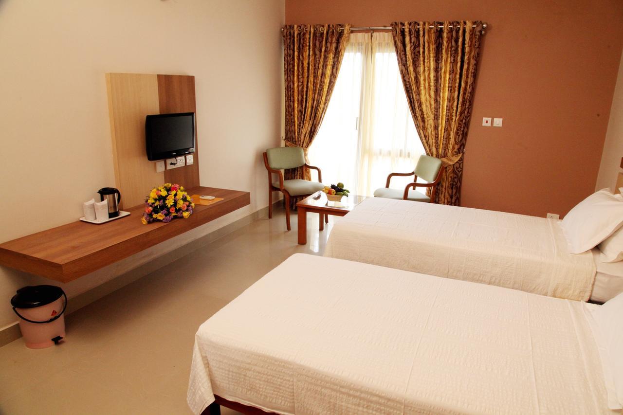 Hotel Polariz Parassinikkadavu Chambre photo